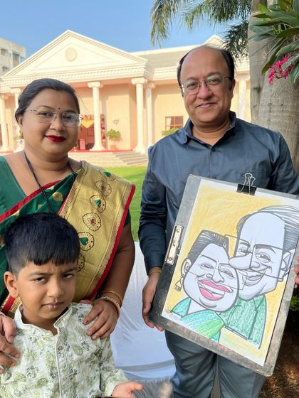 A family portrait from the same wedding event. The little boy seems a bit unsure, but the parents are thrilled.