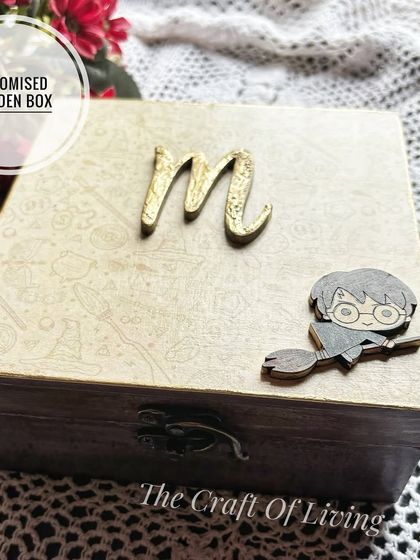 A custom handmade wooden box with a Harry Potter theme, personalized with the initial 'M'. A perfect gift for Raksha Bandhan or any special occasion.
