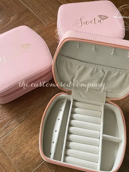 A beautiful and practical gift for your bridesmaids, these personalized jewelry boxes keep their precious items safe. We can customize them with names and a small design, making it a cherished keepsake.