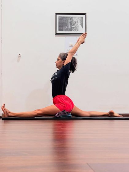 Hanumanasana (Monkey Pose). Joining the palms in Anjali Mudra aligns the left and right sides of the brain, stimulates the chakras, and cultivates feelings of gratitude, humility, and compassion.