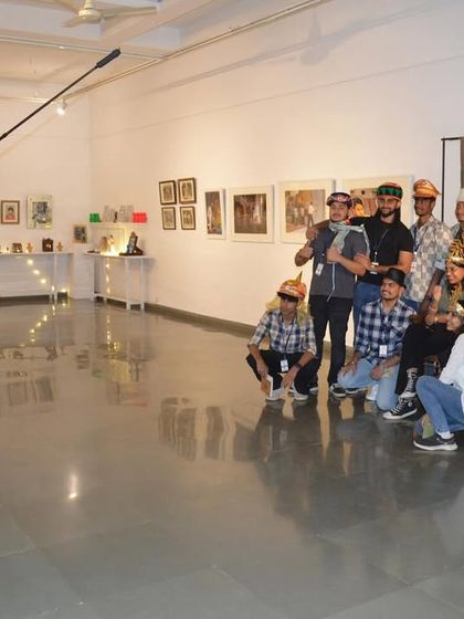 Students having fun with the interactive photo studio setup, using props to create their own cinematic scene.