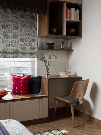 This little corner makes space for stillness and stories. I designed this study nook next to a window seat, creating a perfect spot for everything from morning light to evening musings. The custom millwork and patterned roman blinds add a touch of traditional charm.