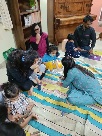 Parents and children enjoy the craft session together, a hallmark of our community-focused workshops.