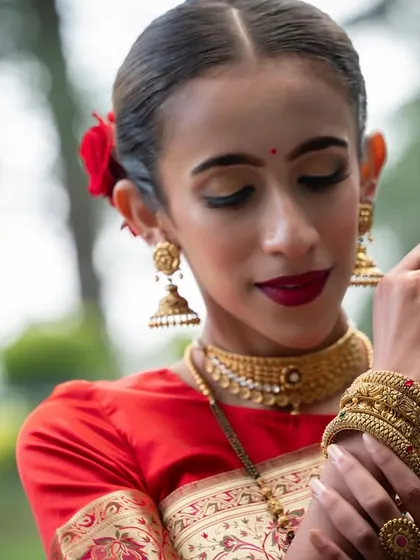 A portrait highlighting the beautiful gold bangles and rings from a jewelry campaign.