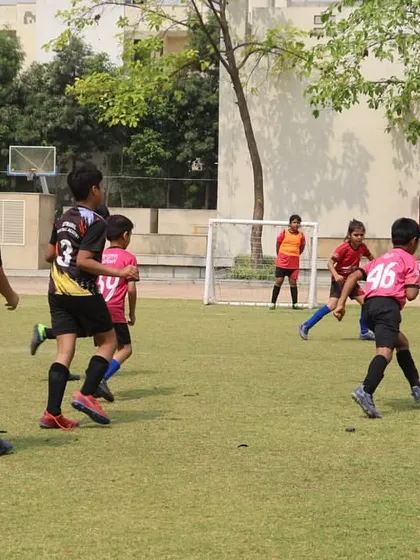 Players battling for possession during a heated league match. We train our athletes to be tenacious and determined while upholding the spirit of the game.