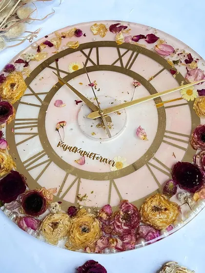 Another beautiful 16-inch clock. The soft pink resin and a mix of yellow and red preserved roses create a warm and romantic timepiece.