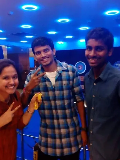 Friends flashing victory signs after a fun session. Our indoor range is a popular spot for young people and groups looking for a unique activity.
