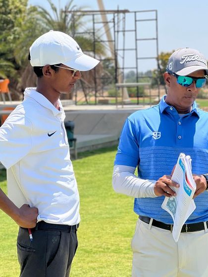 A one-on-one discussion on the range. I believe in giving players work to do both on and off the course to test their discipline and commitment.
