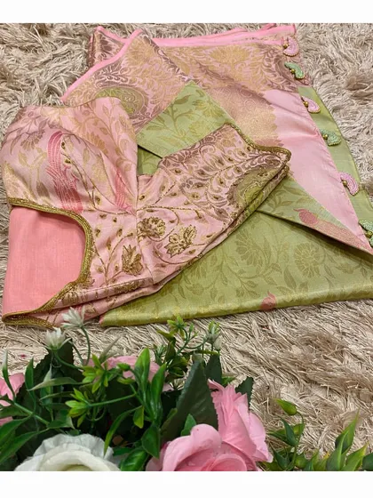 A lovely pink and green combination. This embroidered blouse is made from the saree's brocade border fabric, creating a perfectly coordinated look.