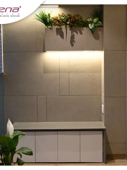 Even small spaces like a balcony can be transformed. We created this cozy nook with a storage bench and a wall-mounted planter box with integrated lighting, making it a perfect spot to relax.