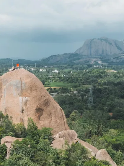 The Gaali Kallu spire with its new flag, set against the backdrop of the Ramanagara hills. This project was a meaningful collaboration with the local community.