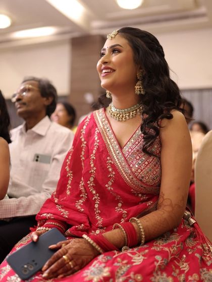 The happiness on her face says it all. This candid shot captures our bride enjoying her sangeet, looking effortlessly beautiful with her soft glam makeup.