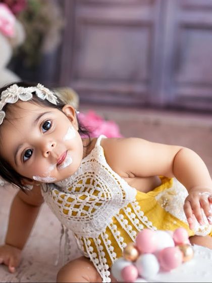 A curious, cake-covered glance that melts your heart. I make sure to capture these close-up shots that highlight your baby's adorable features and reactions.