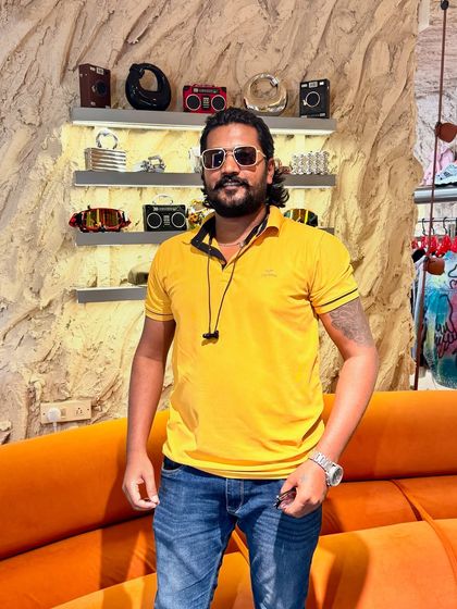 Posing in a cool spot. You can see one of my own tattoos on my arm. I understand the commitment and meaning behind getting inked because I'm passionate about it myself.