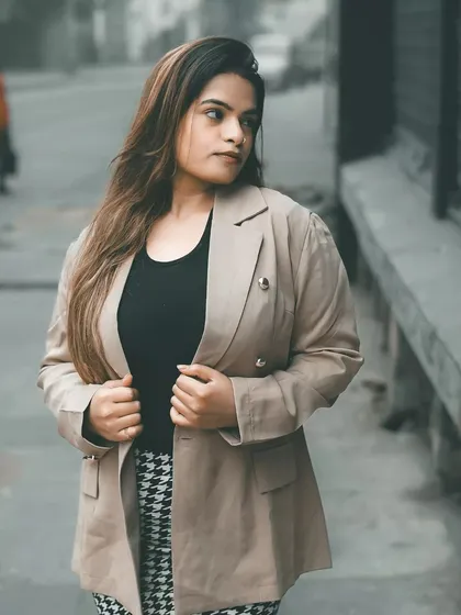 A candid-style shot that looks like a moment captured between poses. These are often the most authentic images, showing a natural and unforced personality.