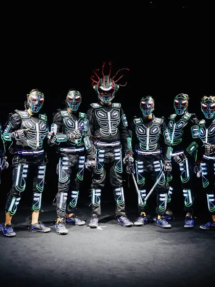 A powerful group pose showcasing the full crew in our armored Tron costumes. Each suit has a unique helmet design, adding to the futuristic warrior look of the performance.