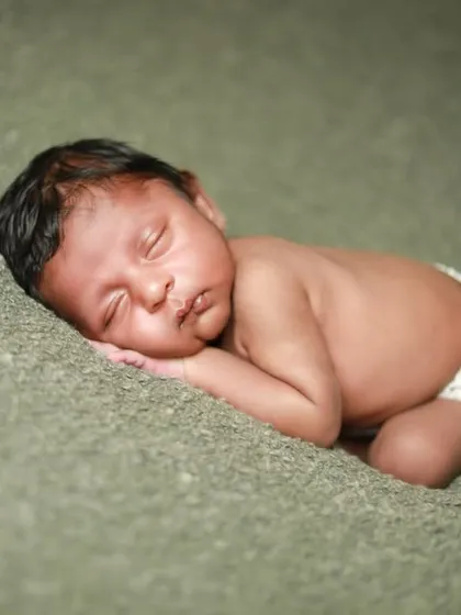 A simple and natural pose on a soft green blanket. Sometimes less is more when you have a subject this beautiful. A true little dreamer.