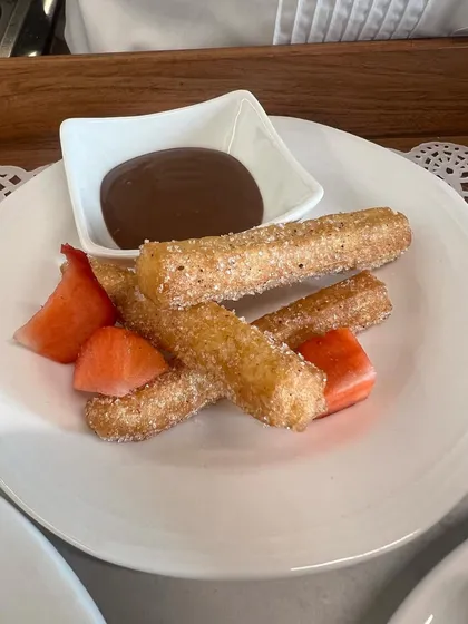 Freshly made churros, dusted with cinnamon sugar and served with a rich chocolate dipping sauce. This was the dessert course for our first sit-down lunch event.