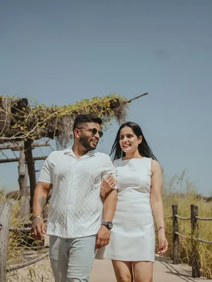 Walking and talking together, sharing a laugh. These unposed, in-between moments are often the most cherished, reflecting the easy companionship of the couple.