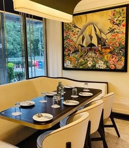 This piece for Havemore restaurant reimagines the Lotus Temple as a bloom in a lush, fantastical garden, blending architecture with nature.