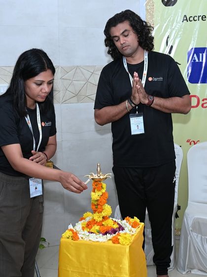 The lamp lighting ceremony to inaugurate the All India Yogasana Competition. We begin all our events with this traditional gesture to invoke blessings and set a positive intention.