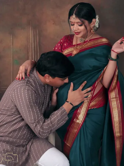 A classic bump kiss pose, inspired by traditional Indian art. The rich colors and textures create a stunning visual.