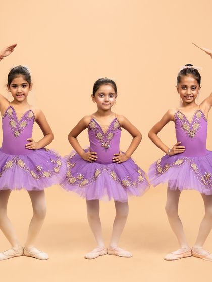 Our little ballerinas posing for their performance of 'Coppélia Reimagined.' Their doll like elegance and static poses are central to this whimsical and charming ballet piece.