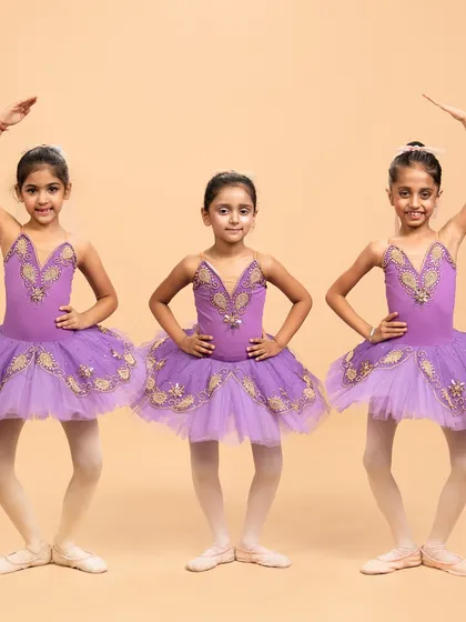Our little ballerinas posing for their performance of 'Coppélia Reimagined.' Their doll like elegance and static poses are central to this whimsical and charming ballet piece.