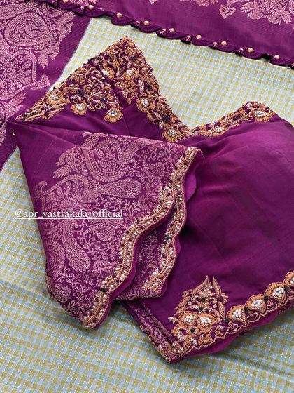 The sleeves of the purple paisley blouse.