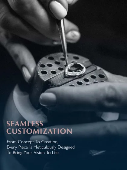 Seamless customization. From concept to creation, every piece is meticulously designed to bring your vision to life. An artisan works on a pear-shaped diamond piece, ensuring every detail is perfect.