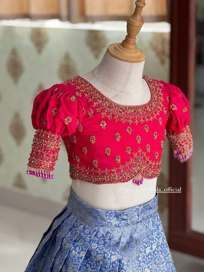 Another angle of the intricately embroidered blouse for our kids' collection, designed for both comfort and style.