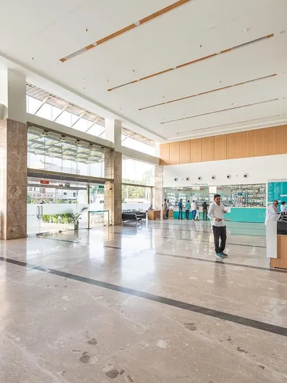 Another view of the Sarvesh Health City entrance, highlighting the clear line of sight to the reception and pharmacy. This intuitive layout is a key part of our patient-centric design strategy, ensuring easy navigation for all visitors.