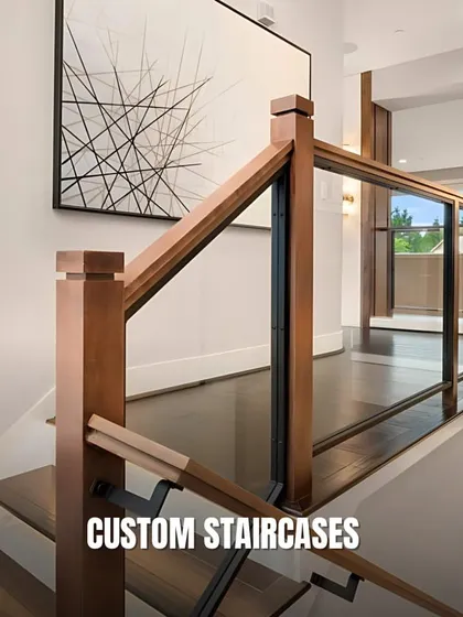 A custom staircase can be a stunning architectural feature. This example combines wood and glass for a modern and transparent look that enhances the sense of space.