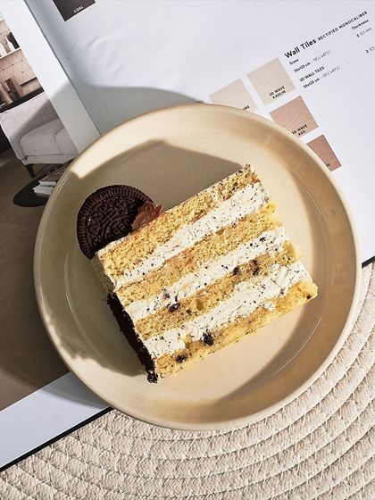 An overhead shot of a slice of my Cookie and Cream Cake, showing the beautiful layers and textures.