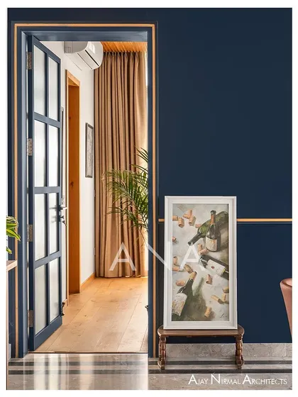 A detail view showing the transition from the dining area to a bedroom in Apartment 704. The fluted glass door allows light to travel through, creating a hazy visual connection and enhancing the home's open feel.