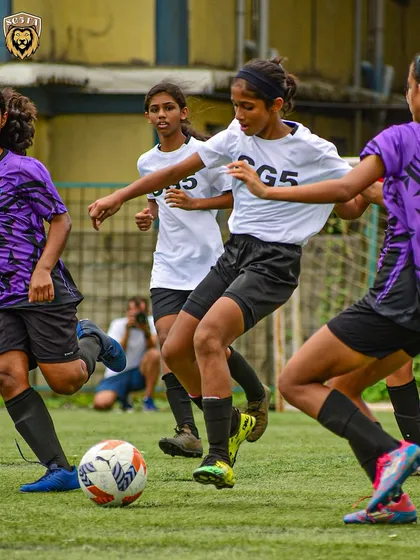 Teamwork in action as our players press together to win back the ball. We emphasize collective effort and tactical awareness.