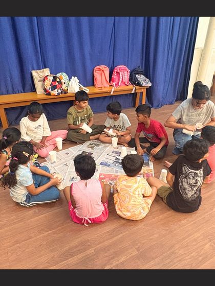 A group of campers fully absorbed in their craft activity. We provide all the materials and guidance needed for them to turn simple items into works of art.
