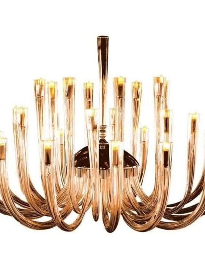 The Castillo Spanish chandelier features gracefully curved arms made of glass. This piece is a modern interpretation of a classic design, offering a unique and elegant lighting solution for any home.