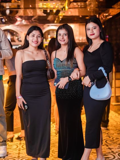 A group of friends looking glamorous for their Tuesday night out.