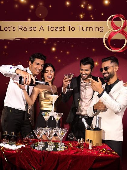 A group shot for The Man Company, capturing a toast to celebrate the brand's 8th anniversary.