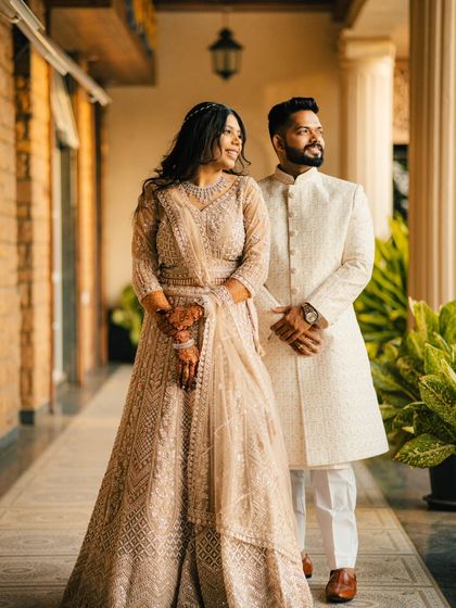 A lovely candid moment where the couple shares a smile. This photo captures their natural chemistry and the happiness they share.