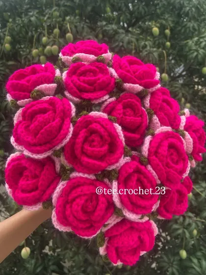 A bouquet of vibrant magenta roses with pink and white accents.
