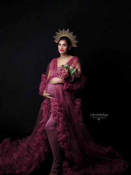 Holding a bouquet of matching flowers, this portrait combines the regal feel of the sunburst crown with the soft texture of the gown.