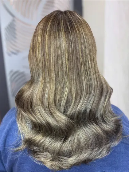Another view of the platinum ash blonde hair. The color is clean and bright, and the soft waves give it a beautiful, elegant finish.