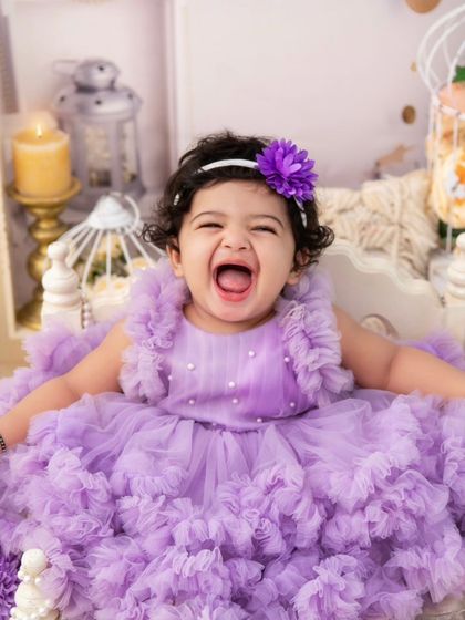 A shout of pure happiness! I love capturing these expressive moments that show a child's true personality.