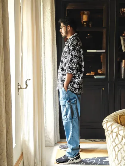This shot, taken in Gwalior, places the H&M outfit in a real-world, travel-oriented setting, blending fashion with exploration.