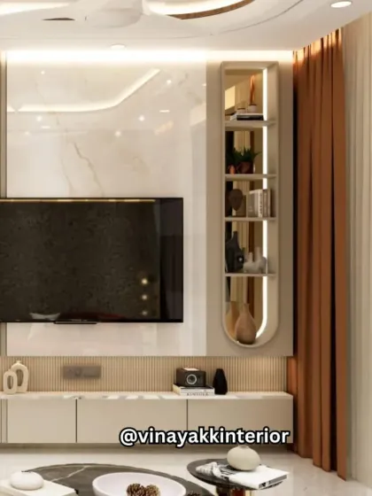 This view showcases the living area's TV unit, which features a marble accent wall and a sleek, integrated shelf. The design maintains the home's warm and modern aesthetic, ensuring every corner is both beautiful and practical.
