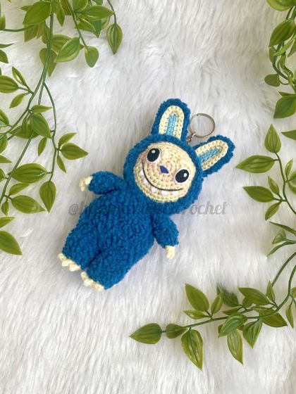 My crochet version of the trendy monster, Labubu! I used a fluffy, textured yarn for his blue suit to make him extra soft and huggable. This one can also be a keychain.