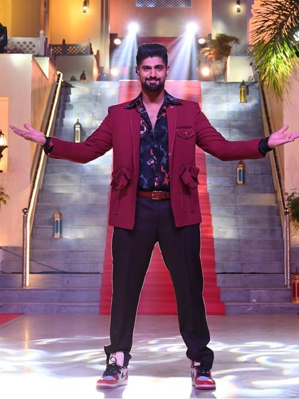 Tanuj Virmani owning the stage in our red designer jacket, a perfect example of occasion wear that commands attention.