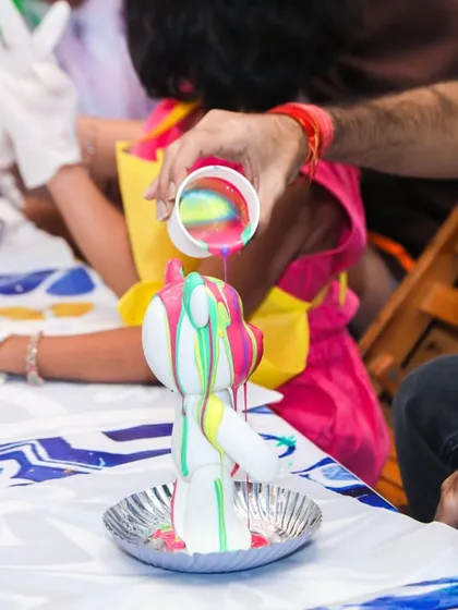 Unleash creativity with our hands-on 3D fluid art station. Guests get to pour vibrant paints over a figurine, creating their own unique marbled masterpiece to take home as a party favor.